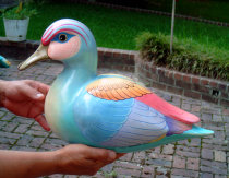 A restored Sergio Bustamante duck sculpture made of paper mache with finely painted feathers,  Universal Fine Art Conservation beautifully 
restored it after the wing was severely dented and broken.
