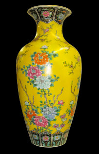 A restored monumentally sized Chinese hand painted vase. The yellow vase is adorned with hand painted flowers and ornamentation.